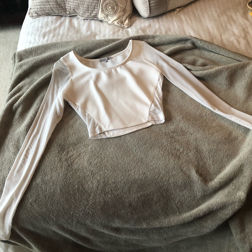 White crop top with mesh sleeves and side paneling
